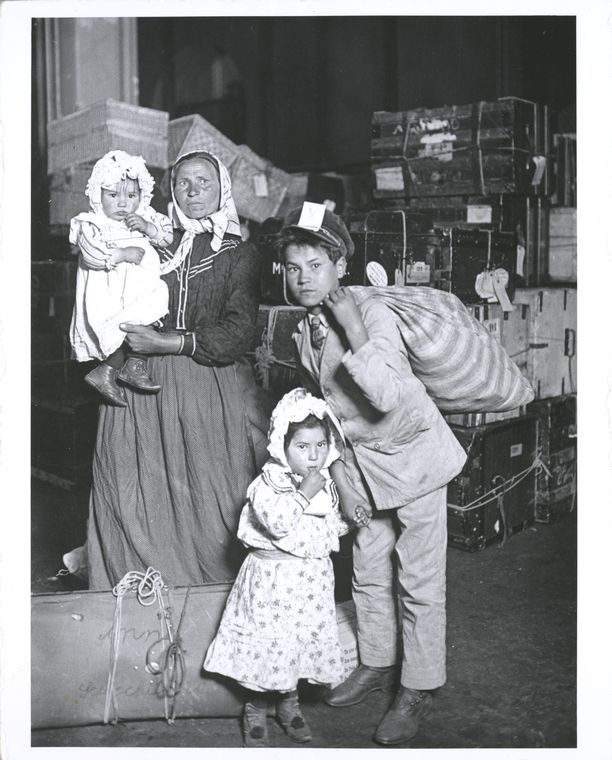 Immigrant family looking for lost baggage, Ellis Island