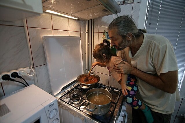 Father and daughter cooking