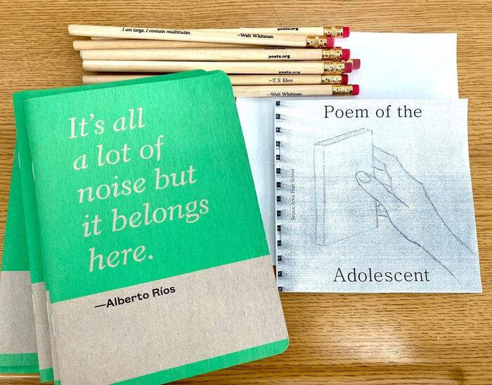 classroom materials: notebooks, pencils, student chapbooks